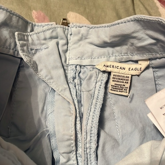 Light blue cheer style pleated miniskirt with back zip and button - Picture 3 of 7